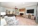 Cozy living room featuring a brick fireplace, comfortable seating, and built-in shelving at 711 Yadkin St, Albemarle, NC 28001