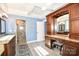 Well-appointed main bathroom featuring granite counters, a vanity with stool, and a glass shower at 711 Yadkin St, Albemarle, NC 28001