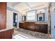 Spacious main bathroom with dual vanities, granite countertops, and a separate water closet at 711 Yadkin St, Albemarle, NC 28001