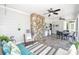 Cozy screened-in porch features a tile floor, a ceiling fan, a stone fireplace and comfortable seating at 711 Yadkin St, Albemarle, NC 28001