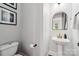Bathroom with a pedestal sink, wood floors and neutral paint at 739 Terrace Park, Rock Hill, SC 29730