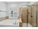 This bathroom features a tub and glass shower, perfect for relaxing at 739 Terrace Park, Rock Hill, SC 29730