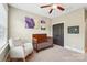 Inviting Bedroom features a wooden crib, comfortable rocking chair, and serene artwork at 739 Terrace Park, Rock Hill, SC 29730