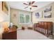 Cozy bedroom features a wooden crib, rocking chair, and decorative artwork, perfect for a Bedroom at 739 Terrace Park, Rock Hill, SC 29730