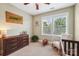 Charming bedroom featuring a wooden crib, rocking chair, and natural light from the bright window at 739 Terrace Park, Rock Hill, SC 29730