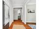 Inviting entryway featuring hardwood floors, white trim, and views of an elegant powder room at 739 Terrace Park, Rock Hill, SC 29730