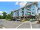 A blue apartment building with lots of windows and balconies and several commercial units at 739 Terrace Park, Rock Hill, SC 29730