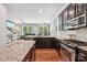 Spacious kitchen with stainless appliances, wood floors, granite countertops and a view into the living area at 739 Terrace Park, Rock Hill, SC 29730