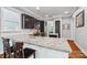 Bright kitchen features dark wood cabinetry, stainless appliances, a large island and beautiful granite countertops at 739 Terrace Park, Rock Hill, SC 29730