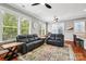 Spacious living room with hardwood floors, large windows, and modern ceiling fans at 739 Terrace Park, Rock Hill, SC 29730