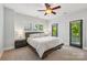 Serene main bedroom with a modern bed, balcony access, and dark trim windows, offering relaxation and style at 739 Terrace Park, Rock Hill, SC 29730