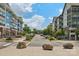A view down a street with apartment buildings and trees in a mixed-use development at 739 Terrace Park, Rock Hill, SC 29730