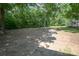 Spacious backyard with mature trees, ideal for outdoor activities at 7645 Robinson Church Rd, Harrisburg, NC 28075