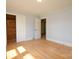 Bedroom featuring hardwood floors, ample natural light, and closet access for convenient storage at 7645 Robinson Church Rd, Harrisburg, NC 28075