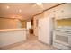 Spacious eat-in kitchen boasts white appliances, providing a bright and functional space for meal preparation at 7645 Robinson Church Rd, Harrisburg, NC 28075