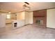 Open-concept room with fireplace, tile flooring, and modern light fixture at 7645 Robinson Church Rd, Harrisburg, NC 28075