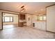 Open-concept area leading to the kitchen with tile floors and an updated light fixture at 7645 Robinson Church Rd, Harrisburg, NC 28075