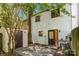 Exterior view of a home with a patio, storage shed, and a fenced yard for added privacy at 8266 Knights Bridge Rd, Charlotte, NC 28210
