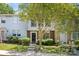 Traditional multi-level home showcasing manicured landscaping and a classic front entrance at 8266 Knights Bridge Rd, Charlotte, NC 28210