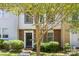 Traditional multi-level home showcasing manicured landscaping and a classic front entrance at 8266 Knights Bridge Rd, Charlotte, NC 28210