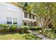 Traditional multi-level home showcasing manicured landscaping and a classic front entrance at 8266 Knights Bridge Rd, Charlotte, NC 28210