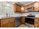 Charming kitchen featuring stainless steel appliances, granite countertops, and wood cabinets at 8266 Knights Bridge Rd, Charlotte, NC 28210