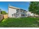 Back exterior featuring a well-maintained lawn, with a wooden fence at 8325 Burgundy Ridge Dr, Harrisburg, NC 28075