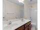 Bathroom featuring double sink vanity, and a shower over tub with white tile surround at 8325 Burgundy Ridge Dr, Harrisburg, NC 28075