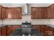 Modern kitchen featuring granite countertops, stainless steel appliances, and tile backsplash at 8325 Burgundy Ridge Dr, Harrisburg, NC 28075