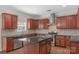 Modern kitchen featuring granite countertops, stainless steel appliances, and island at 8325 Burgundy Ridge Dr, Harrisburg, NC 28075