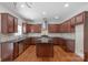Modern kitchen featuring granite countertops, stainless steel appliances, and an island at 8325 Burgundy Ridge Dr, Harrisburg, NC 28075