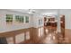 Open concept living room featuring hardwood floors and lots of natural light at 8325 Burgundy Ridge Dr, Harrisburg, NC 28075