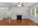 Bright living room with a fireplace, hardwood floors, and lots of natural light at 8325 Burgundy Ridge Dr, Harrisburg, NC 28075
