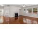 Cozy living room featuring hardwood floors, a fireplace, and lots of natural light at 8325 Burgundy Ridge Dr, Harrisburg, NC 28075