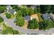 Aerial view of a home with mature trees and a well-manicured lawn in a quiet residential neighborhood at 8343 Highlander Ct, Charlotte, NC 28269