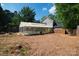 Wide backyard with an enclosed pool and lush, mature trees at 8343 Highlander Ct, Charlotte, NC 28269