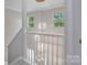 Elegant stairway with modern lighting and white banister at 8343 Highlander Ct, Charlotte, NC 28269