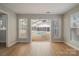 Bright sunroom with a glimpse of an indoor pool through sliding glass doors at 8343 Highlander Ct, Charlotte, NC 28269