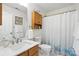 Neutral bathroom with a shower curtain, framed prints and plentiful lighting at 8529 Indian Summer Trl, Harrisburg, NC 28075