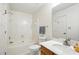 Clean bathroom featuring a combined bathtub and shower, toilet, and a vanity with sink at 8529 Indian Summer Trl, Harrisburg, NC 28075