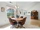 Bright dining room featuring a wooden table set and a window offering views of the outdoors at 8529 Indian Summer Trl, Harrisburg, NC 28075