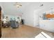 Bright living area with vaulted ceiling, wood flooring, and an open layout at 8529 Indian Summer Trl, Harrisburg, NC 28075
