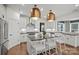 Well-lit kitchen featuring a central island, stainless appliances, and stylish pendant lighting at 1045 Waxhaw Crossing Dr, Waxhaw, NC 28173