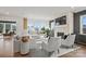 Bright living room with a fireplace, large windows, neutral furniture, hardwood floors and modern accents at 1045 Waxhaw Crossing Dr, Waxhaw, NC 28173