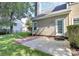 Spacious backyard featuring a patio, green lawn and exterior access door to home at 11305 Hunters Landing Dr, Charlotte, NC 28273