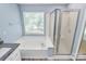 Bathroom with bathtub, shower and window at 11305 Hunters Landing Dr, Charlotte, NC 28273