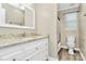 Bathroom featuring granite counters and white cabinets, plus a toilet and separate shower/tub area at 11305 Hunters Landing Dr, Charlotte, NC 28273