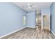 Brightly lit bedroom with an ensuite bathroom and wood-look flooring at 11305 Hunters Landing Dr, Charlotte, NC 28273