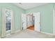 Cozy bedroom featuring carpet floors, neutral walls, and natural light at 11305 Hunters Landing Dr, Charlotte, NC 28273