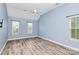 Light and airy bedroom with vaulted ceilings, ceiling fan and two large windows at 11305 Hunters Landing Dr, Charlotte, NC 28273
